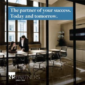 NS Partners Business meeting in modern office space.